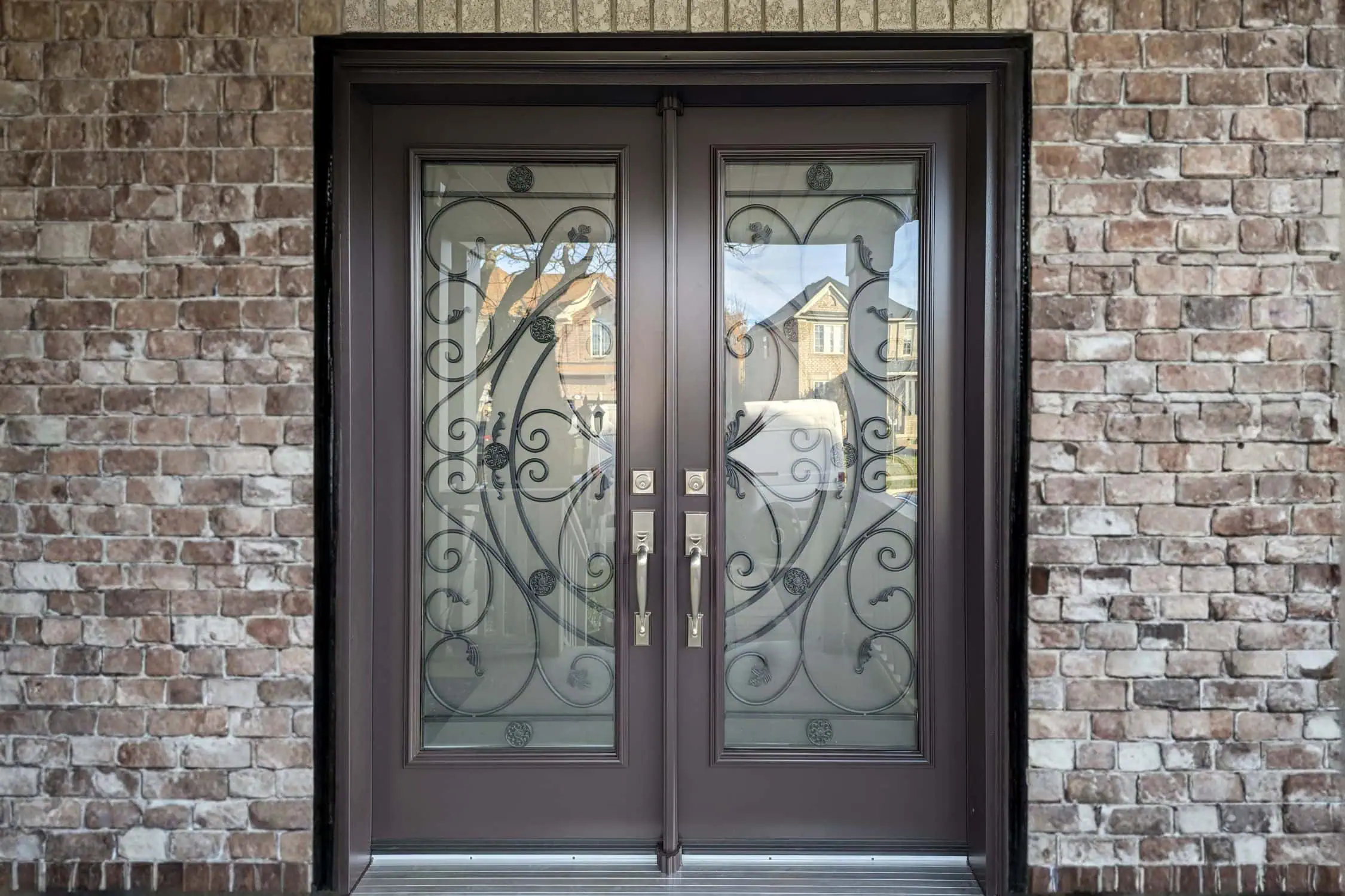 how to seal double doors - brown double doors with wrought iron glass