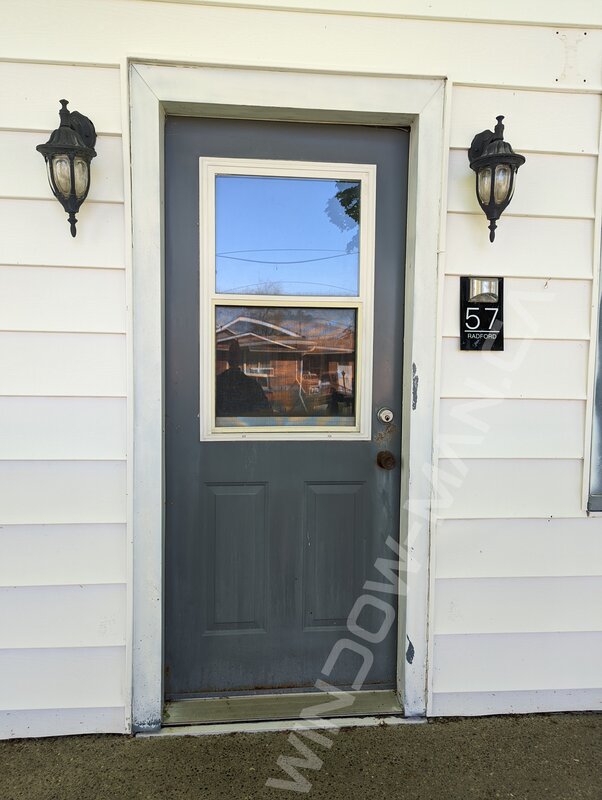 black steel door with 3/4 blackburn wrought iron glass and storm door - before-after