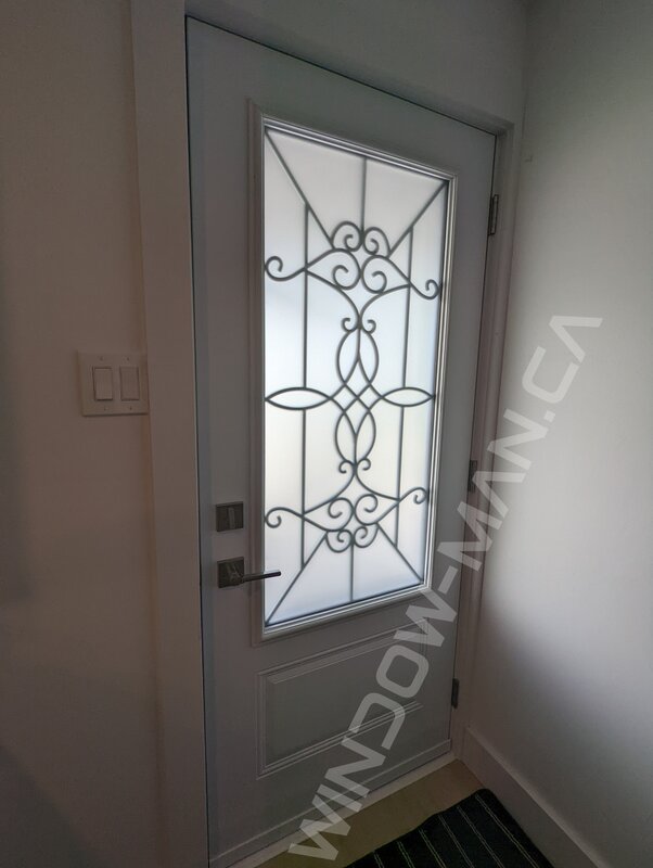 black steel door with 3/4 blackburn wrought iron glass and storm door - view from the inside